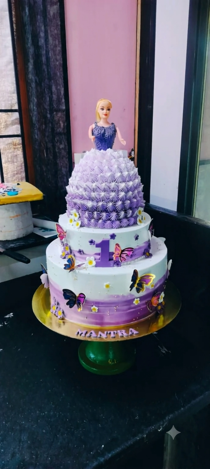 Purple tiered cake with a doll decoration